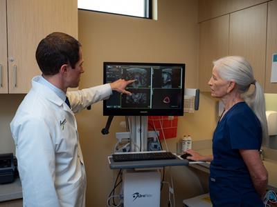 Provider and nurse reviewing images on computer